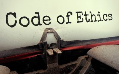 Code of Ethics typed on retro typewriter perspective view.